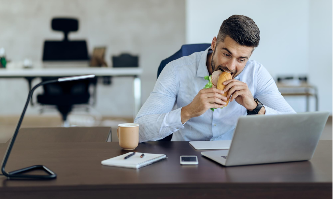 Stock image of businessman with catering box